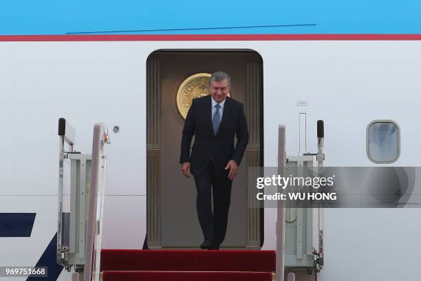 Uzbekistan President Shavkat Mirziyoyev arrives at Qingdao Liuting International Airport for the 18th Shanghai Cooperation Organization Summit in...