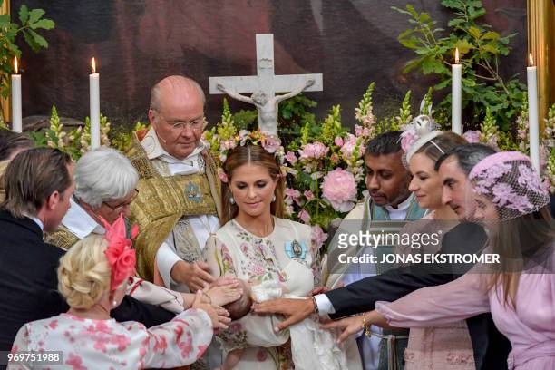 Princess Madeleine of Sweden holds her child princess Adrienne of Sweden together with the god parents Anouska d'Abo, Coralie Charriol Paul, Nader...