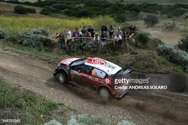 Norwegian driver Mads Ostberg and compatriote co-driver Torstein Eriksen drive their Citroen C3 WRC near Castelsardo village, on the second day of...