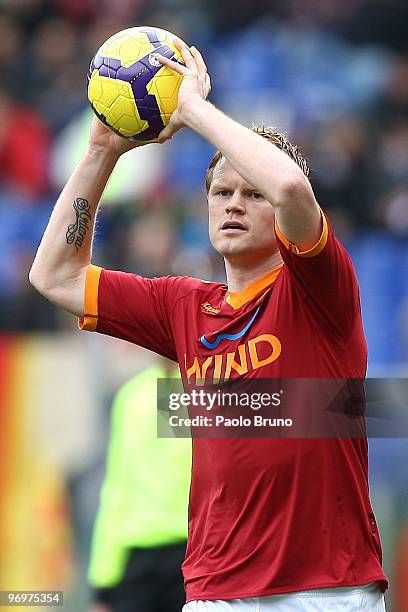 John Arne Riise of AS Roma takes the ball during the Serie A match between AS Roma and Catania Calcio at Stadio Olimpico on February 21, 2010 in...