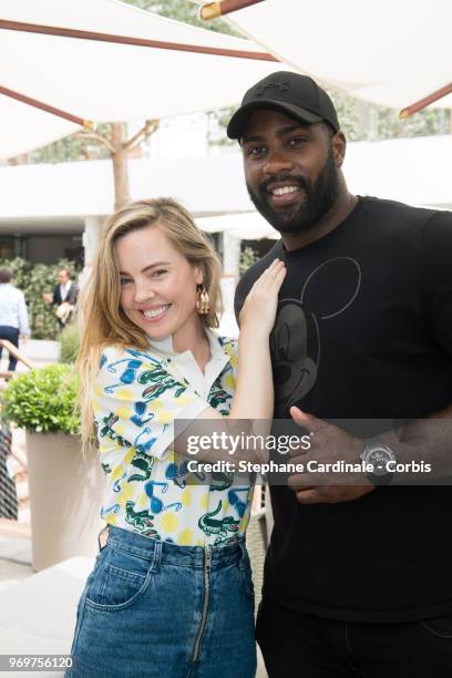 Actress Melissa George and World Judo Champion Teddy Riner attend the 2018 French Open - Day Thirteen at Roland Garros on June 8, 2018 in Paris,...