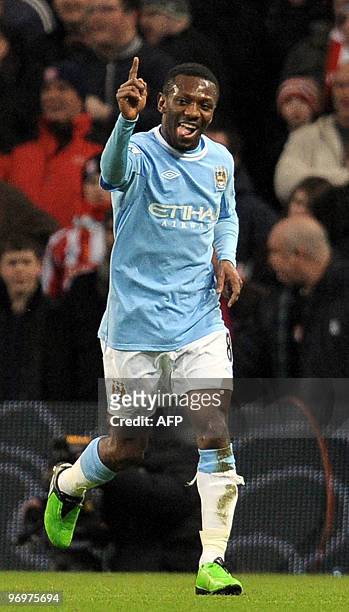 Manchster City's English midfielder Shaun Wright-Phillips celebrates after scoring the opening goal of the FA Cup fifth round football match between...