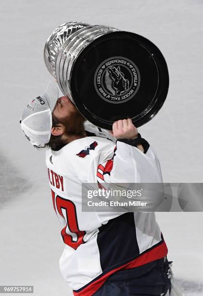 Braden Holtby of the Washington Capitals kisses the Stanley Cup after the team's 4-3 win over the Vegas Golden Knights in Game Five of the 2018 NHL...