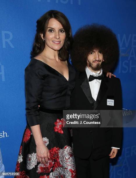 Actress/comedian Tina Fey poses with a participant from the Make-A-Wish Foundation at the 35th Anniversary Make-A-Wish Metro New York Gala at...