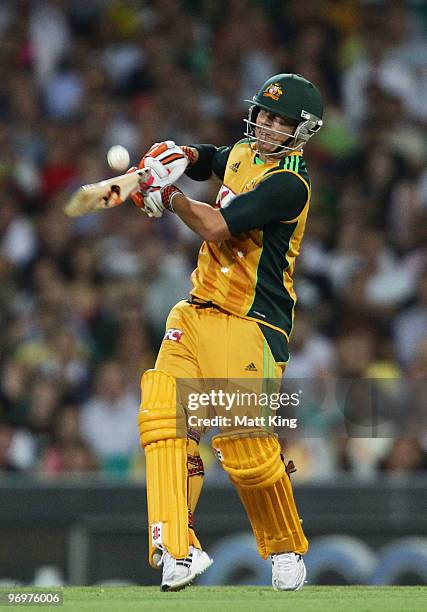 David Warner of Australia hits a six during the Twenty20 International match between Australia and the West Indies at the Sydney Cricket Ground on...