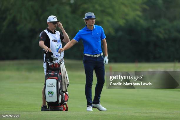 Tapio Pulkkanen of Finland looks on with his caddy on the 16th fairway during day two of The 2018 Shot Clock Masters at Diamond Country Club on June...