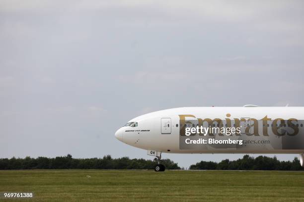 Boeing Co. 777-300ER passenger jetliner, operated by Emirates Airline, taxis on the runway at London Stansted Airport in Stansted, U.K., on Friday,...