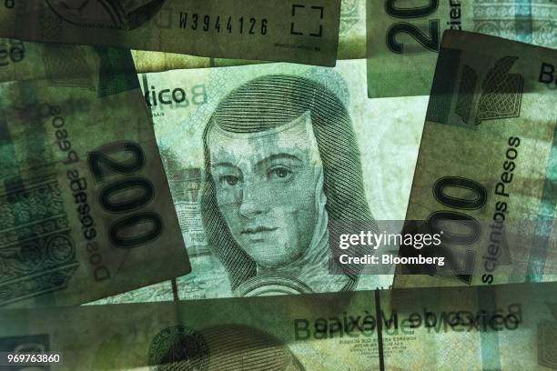 Mexican 200 peso banknotes depicting the image of Sister Joan Agnes of the Cross are arranged for a photograph in San Luis Potosi, Mexico, on...