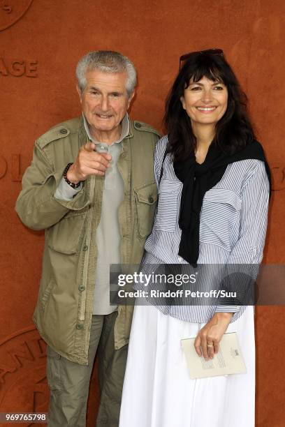 Director Claude Lelouch and his companion Valerie Perrin attends the 2018 French Open - Day Thirteen at Roland Garros on June 8, 2018 in Paris,...