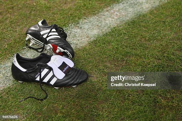 Football boots lie on the pitch before the Second Bundesliga match between 1.FC Kaiserslautern and FC St. Pauli at Fritz-Walter Stadium on February...