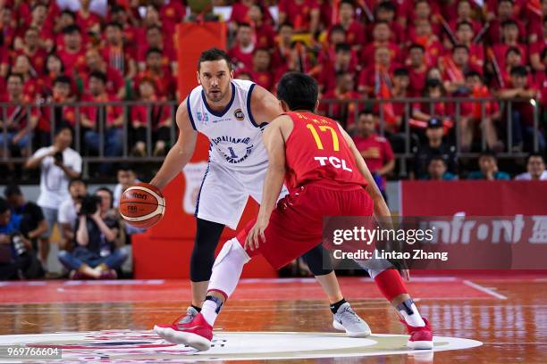 Adam Gibson of Australian drives to the basket against Sun Minghui of China during the 2018 Sino-Australian Men's Internationl Basketball Challenge...