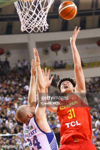 Jesse Wagstaff of Australia defends against Wang Zhelin of China during the 2018 Sino-Australian Men's Internationl Basketball Challenge match...