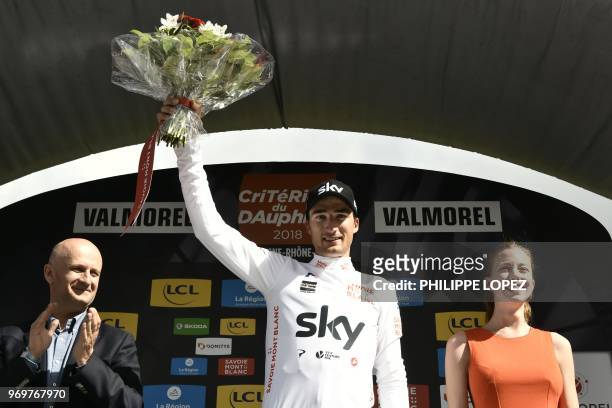 Italy's Gianni Moscon, wearing the best young's white jersey, celebrates on the podium after the fifth stage of the 70th edition of the Criterium du...