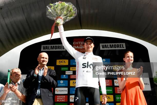 Italy's Gianni Moscon, wearing the best young's white jersey, celebrates on the podium after the fifth stage of the 70th edition of the Criterium du...