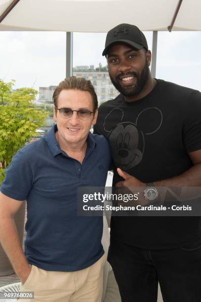Actor Benoit Magimel and World Judo Champion Teddy Riner attend the 2018 French Open - Day Thirteen at Roland Garros on June 8, 2018 in Paris, France.