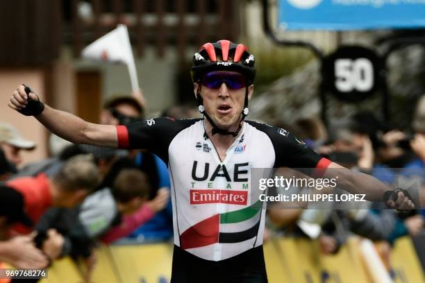 Ireland's Daniel Martin celebrates as he crosses the finish line to win the fifth stage of the 70th edition of the Criterium du Dauphine cycling race...