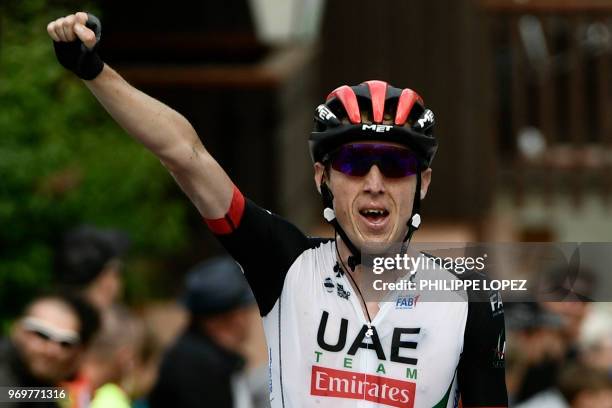 Ireland's Daniel Martin celebrates as he crosses the finish line to win the fifth stage of the 70th edition of the Criterium du Dauphine cycling race...
