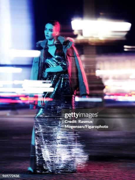 Model Marina Salaet poses at a fashion shoot for Madame Figaro on November 16, 2017 in Paris, France. Parka by Aigle, dress by BA & SH x Jay Ahr....