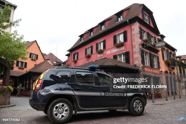 Vehicle of the French Gendarmerie drives past the Chambard hotel on June 8, 2018 in the eastern France region of Alsace village of Kaysersberg, where...