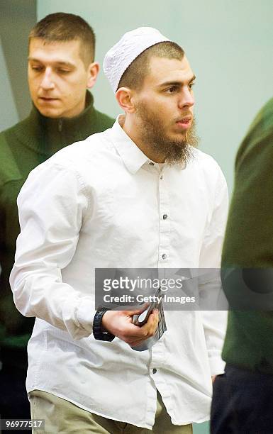 Daniel Schneider attends the 'Sauerland group' terror trial in the courtroom of the county court Duesseldorf on February 23, 2010 in Duesseldorf,...