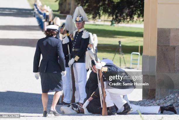 Royal guard collapses during the christening of Princess Adrienne of Sweden at Drottningholm Palace Chapel on June 8, 2018 in Stockholm, Sweden.