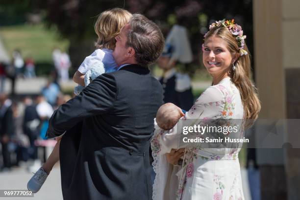 Princess Madeleine of Sweden, holding Princess Adrienne of Sweden, Princess Eleonore of Sweden and Christopher O'Neill holding Prince Nicolas of...