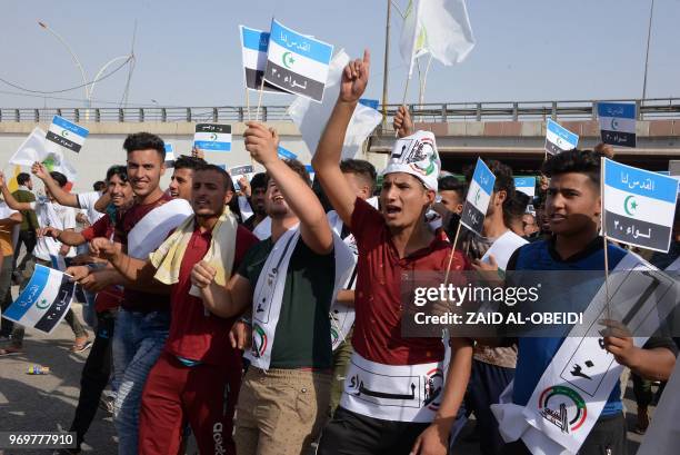 Iraqi men take part in a rally in Mosul on June 8 to mark "Quds day" , a commemoration first initiated by Iran in 1979 to fall on the last Friday of...