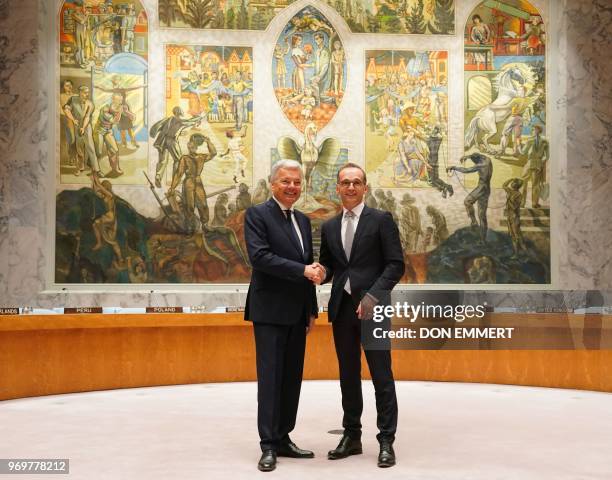 German Foreign Minister Heiko Maas , and Belgian Foreign Minister Didier J.L. Reynders pose for photos on the floor of the Security Council after a...