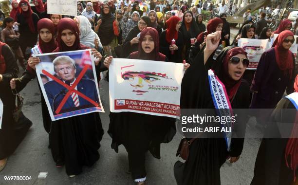 Pakistani Shiite Muslims march during a rally against Israel and the United States to mark the Al-Quds during the holy month of Ramadan in Lahore on...