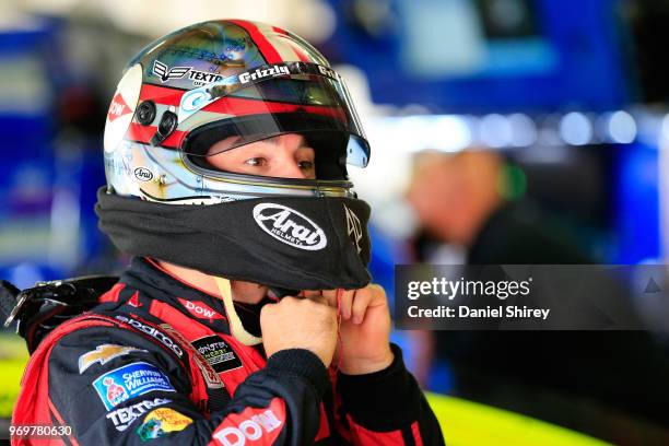 Austin Dillon, driver of the Dow Salutes Veterans Chevrolet, stands by his car during practice for the Monster Energy NASCAR Cup Series Firekeepers...