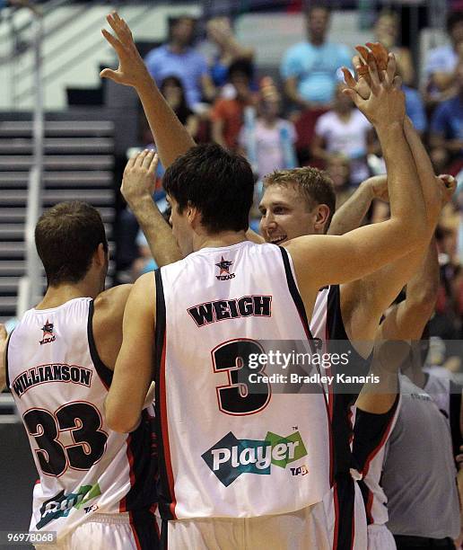 Stephen Weigh celebrates victory with team mates after game two of the NBL Semi Final Series betwen the Gold Coast Blaze and the Peth Wildcats at...