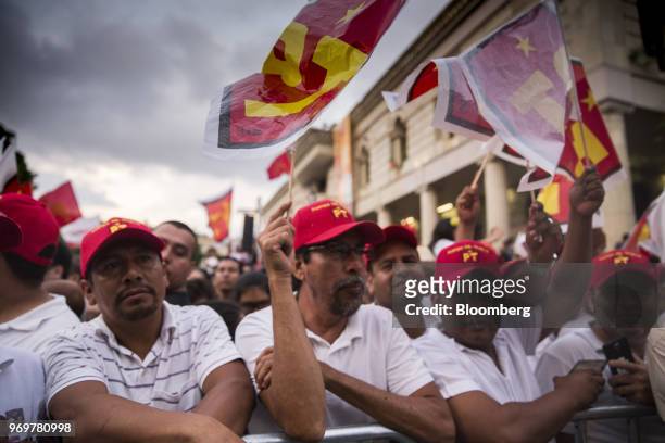 Supporters hold Labor Party flags during a campaign rally for Andres Manuel Lopez Obrador, presidential candidate of the National Regeneration...
