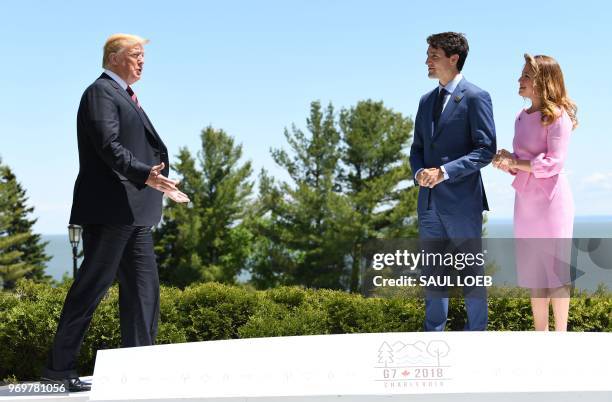 President Donald Trump is greeted by Canadian Prime Minister Justin Trudeau and his wife Sophie Gregoire Trudeau during the G7 Summit in La Malbaie,...