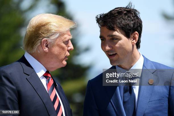 Prime Minister of Canada Justin Trudeau speaks with U.S. President Donald Trump during the G7 official welcome at Le Manoir Richelieu on day one of...