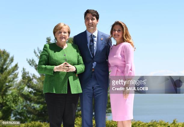 German Chancellor Angela Merkel is greeted by Canadian Prime Minister Justin Trudeau and his wife Sophie Gregoire Trudeau during the G7 Summit in La...