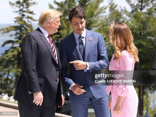 President Donald Trump is greeted by Canadian Prime Minister Justin Trudeau and his wife Sophie Gregoire Trudeau during the G7 Summit in La Malbaie,...