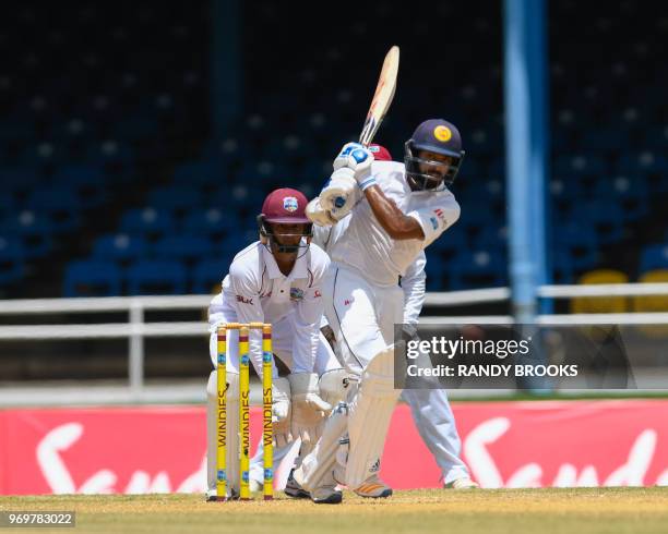 Niroshan Dickwella of Sri Lanka hits 4 during day 3 of the 1st Test between West Indies and Sri Lanka at Queen's Park Oval, Port of Spain, Trinidad,...