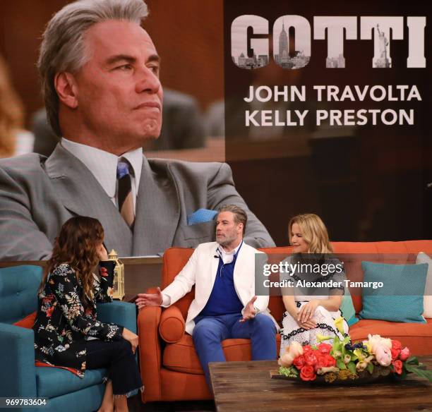 Karla Martinez, John Travolta and Kelly Preston are seen on the set of "Despierta America" at Univision Studios to promote the film "GOTTI" on June...