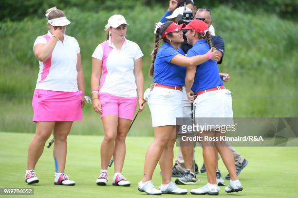 Lilia Vu and Kristen Gillman of the United States celebrate after defeating Alice Hewson and Lily May Humphreys on the 15th green during four-ball...