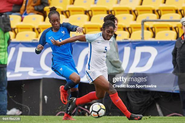 France forward Ouleymata Sarr battles with England defender Anita Asante for the ball during the first half of the SheBelieves Cup match between...