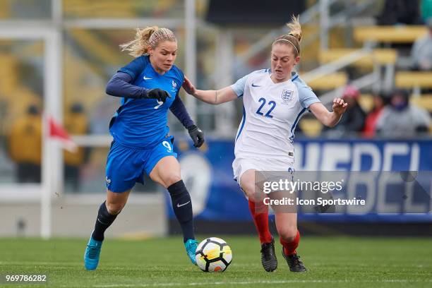 France forward Eugenie Le Sommer battles with England midfielder Keira Walsh for the ball during the first half of the SheBelieves Cup match between...