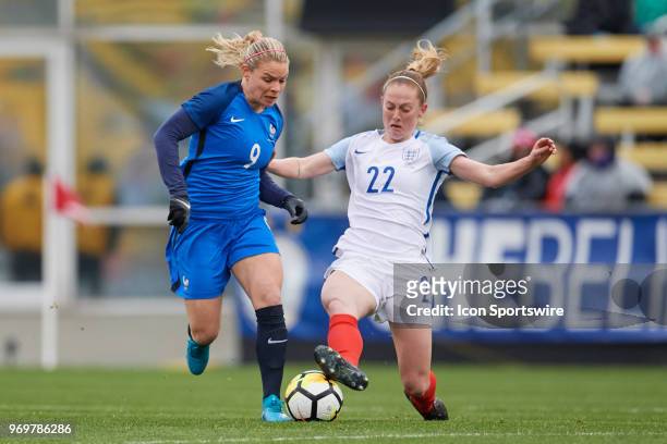 France forward Eugenie Le Sommer battles with England midfielder Keira Walsh for the ball during the first half of the SheBelieves Cup match between...