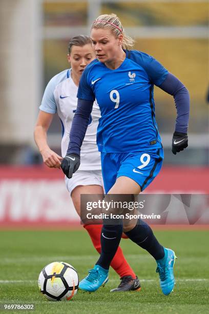 France forward Eugenie Le Sommer dribbles the ball during the first half of the SheBelieves Cup match between England and France on March 01, 2018 at...