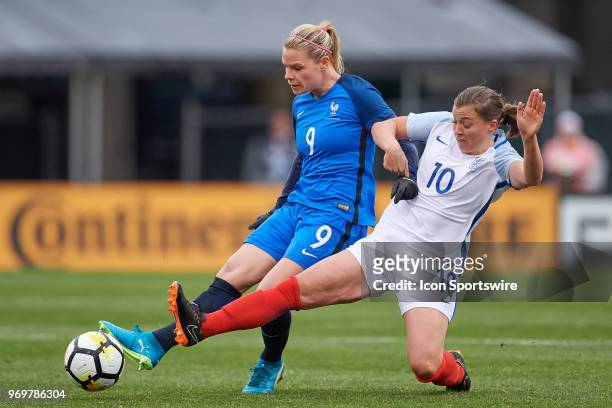 France forward Eugenie Le Sommer shoots the ball past England forward Fran Kirby during the first half of the SheBelieves Cup match between England...