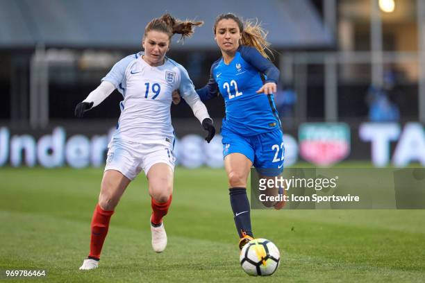 France defender Sakina Karchaoui battles with England forward Mel Lawley for the ball during the SheBelieves Cup match between England and France on...