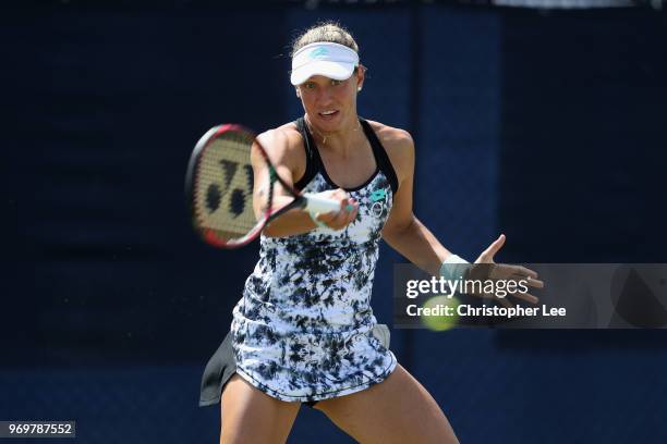 Yanina Wickmayer of Belgium in action against Harriet Dart of Great Britain during their Quarter Final match on Day 7 of the Fuzion 100 Surbition...