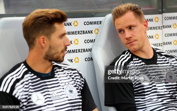 Marc Andre ter Stegen of Germany talks to team mate Kevin Trapp before the International Friendly match between Germany and Saudi Arabia at BayArena...