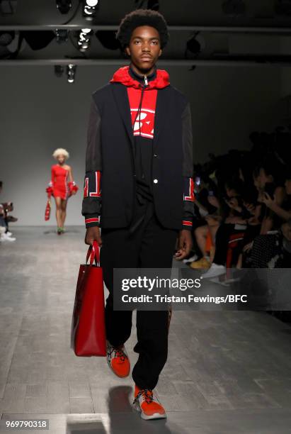 Model walks the runway at the ICEBERG show during London Fashion Week Men's June 2018 at BFC Show Space on June 8, 2018 in London, England.