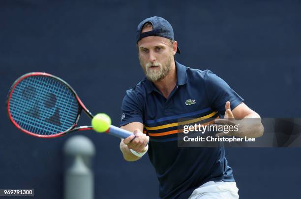 Denis Kudla of USA in action against Jeremy Chardy of France during their Quarter Final match on Day 7 of the Fuzion 100 Surbition Trophy on June 8,...