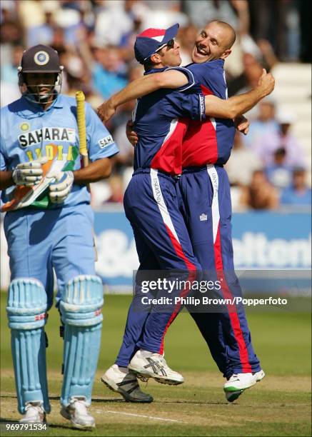 Alex Wharf of England celebrates with Michael Vaughan after taking the wicket of VVS Laxman of India during the 1st NatWest Challenge One Day...